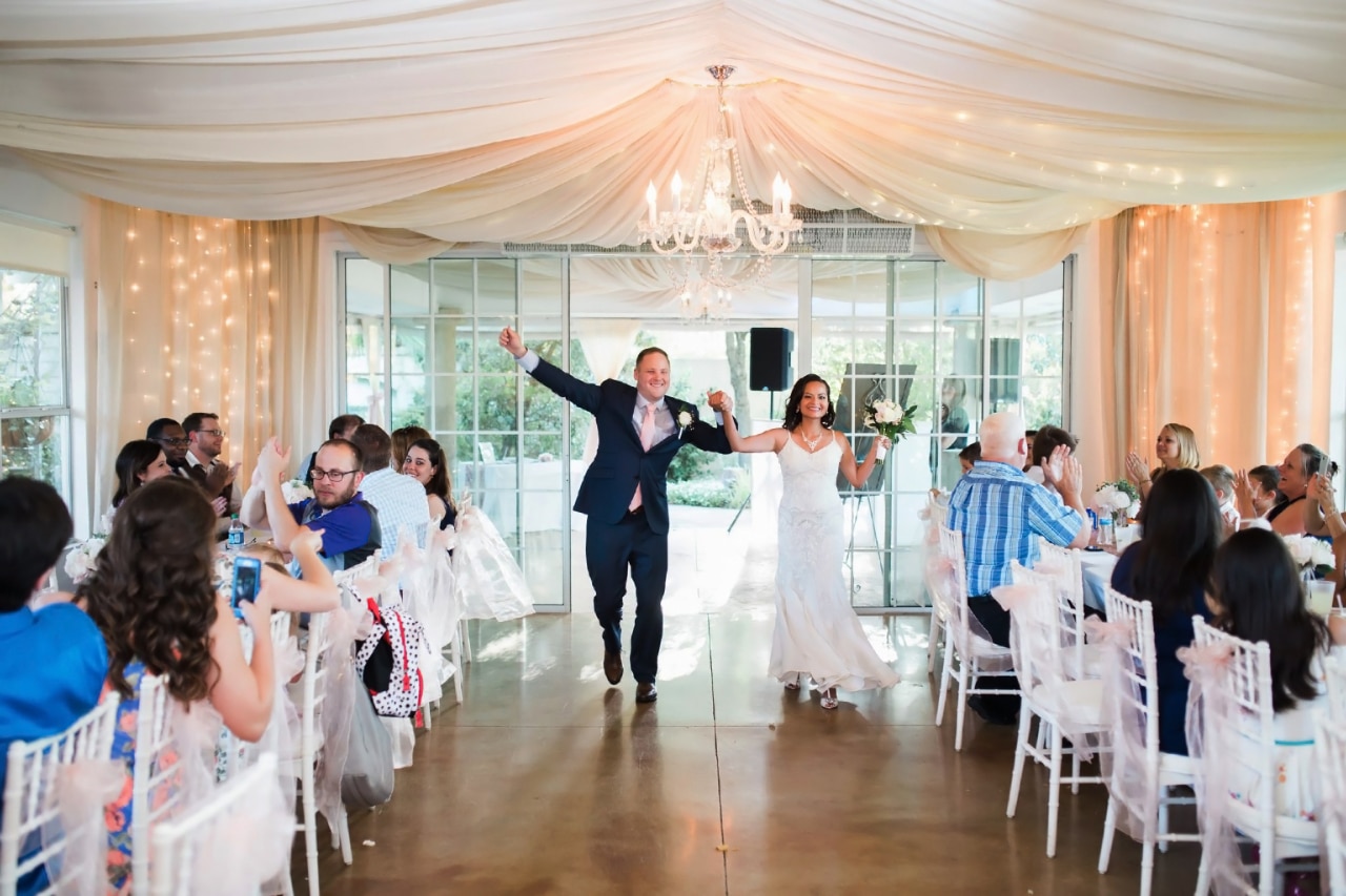 Bride-and-Groom-entering-reception-room